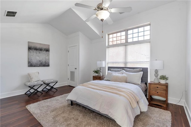 bedroom with ceiling fan, dark hardwood / wood-style flooring, and vaulted ceiling