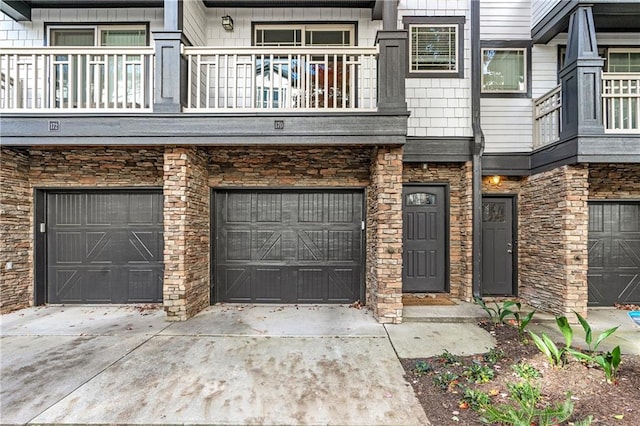 doorway to property with a garage