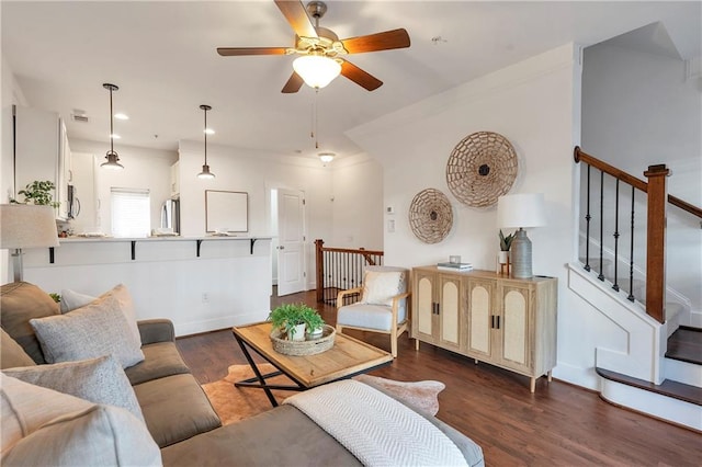 living room with ceiling fan and dark hardwood / wood-style floors