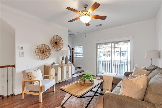 living room with ceiling fan and wood-type flooring