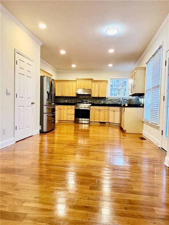 kitchen with light brown cabinetry, ornamental molding, light wood-type flooring, and appliances with stainless steel finishes