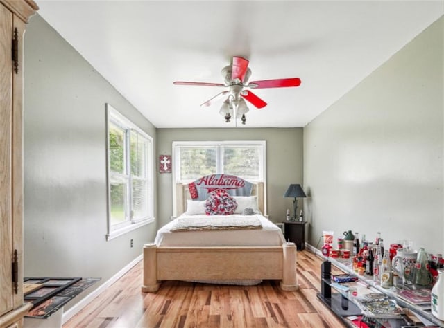 904 Corinth Five Points Rd, Buchanan, GA 30113 - bedroom with light wood-style floors, baseboards, and a ceiling fan