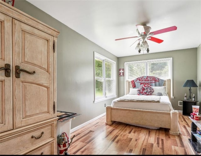 904 Corinth Five Points Rd, Buchanan, GA 30113 - bedroom featuring baseboards, light wood-type flooring, and a ceiling fan