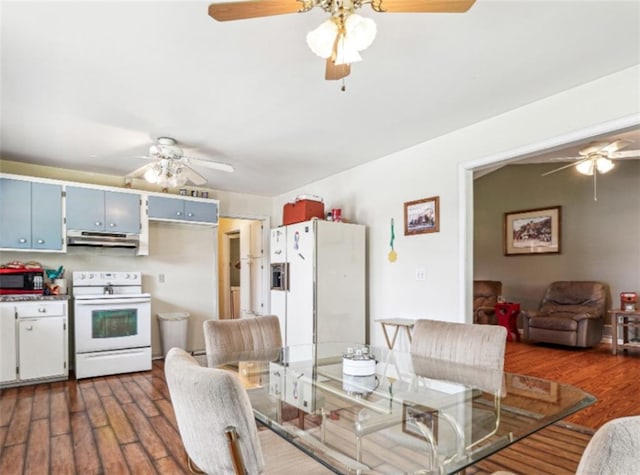 904 Corinth Five Points Rd, Buchanan, GA 30113 - dining room featuring a ceiling fan and dark wood-type flooring
