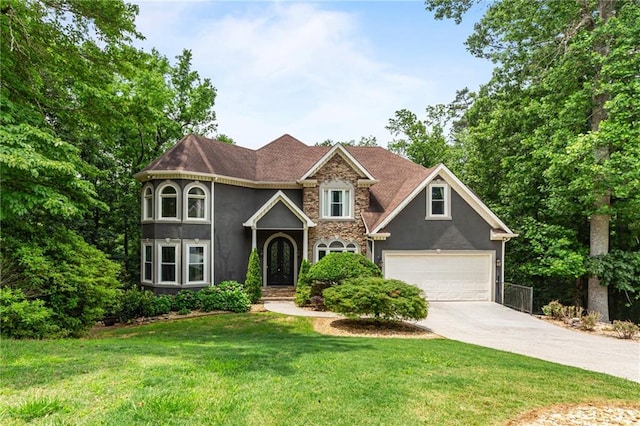 2990 Hearthstone Dr, Cumming, GA 30041 - view of front of property with driveway, stucco siding, a front yard, and stone siding
