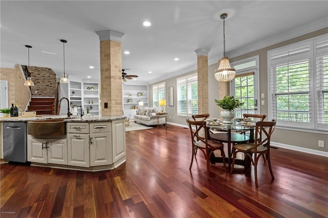 2990 Hearthstone Dr, Cumming, GA 30041 - kitchen with ornate columns, open floor plan, baseboards, dark wood-style floors, and crown molding