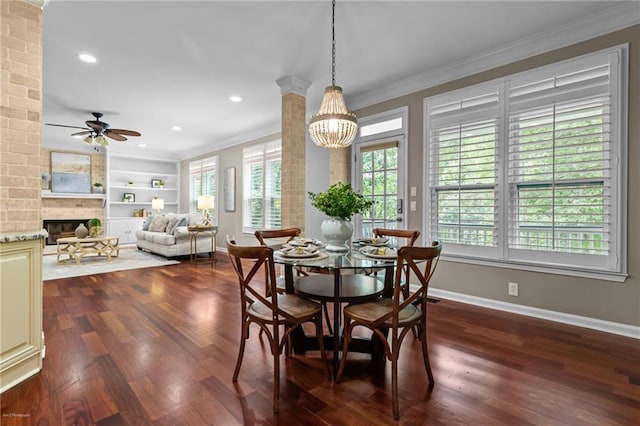 2990 Hearthstone Dr, Cumming, GA 30041 - dining room with ornamental molding, baseboards, a chandelier, a ceiling fan, and a fireplace