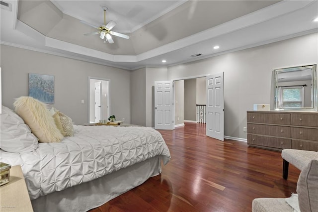 2990 Hearthstone Dr, Cumming, GA 30041 - bedroom with wood finished floors, recessed lighting, ornamental molding, a tray ceiling, and baseboards