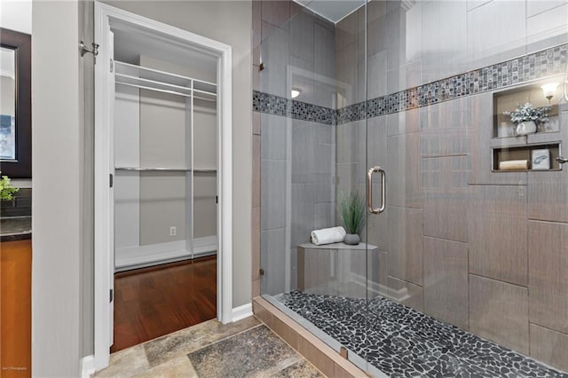 2990 Hearthstone Dr, Cumming, GA 30041 - bathroom featuring a shower stall and a spacious closet