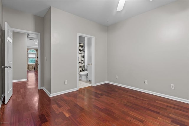 2990 Hearthstone Dr, Cumming, GA 30041 - unfurnished bedroom featuring wood finished floors, baseboards, and ensuite bathroom