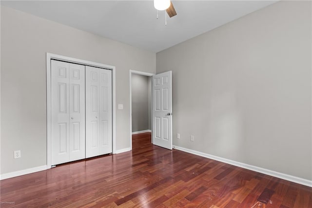 2990 Hearthstone Dr, Cumming, GA 30041 - unfurnished bedroom with wood finished floors, baseboards, a closet, and a ceiling fan