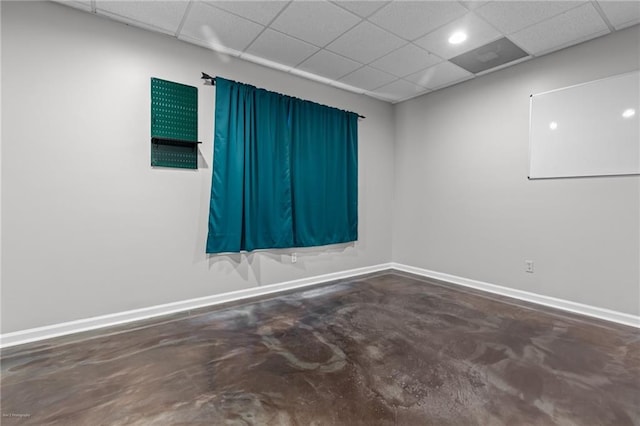 2990 Hearthstone Dr, Cumming, GA 30041 - empty room with concrete flooring, a paneled ceiling, and baseboards
