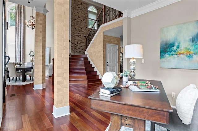 2990 Hearthstone Dr, Cumming, GA 30041 - entrance foyer with wood finished floors, ornamental molding, stairs, baseboards, and ornate columns