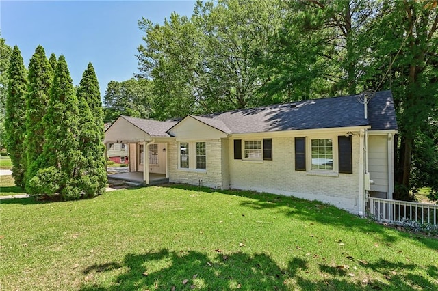 ranch-style home with a front yard