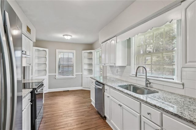 kitchen with white cabinetry, sink, and appliances with stainless steel finishes