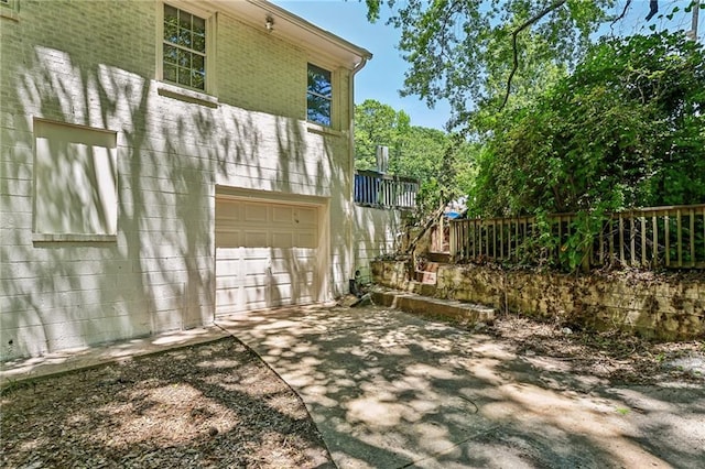 view of side of property featuring a garage