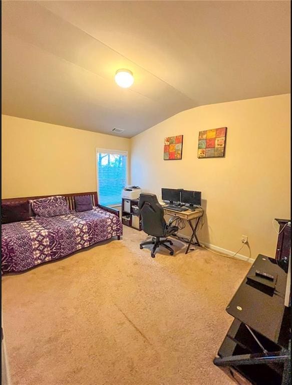 bedroom featuring lofted ceiling and carpet floors