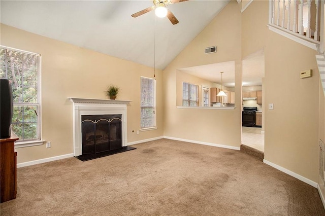 4103 Kingship Dr, Ellenwood, GA 30294 - unfurnished living room with carpet, a ceiling fan, baseboards, a fireplace, and high vaulted ceiling