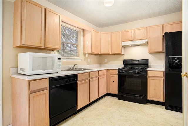 4103 Kingship Dr, Ellenwood, GA 30294 - kitchen with light brown cabinets, black appliances, under cabinet range hood, a sink, and light countertops