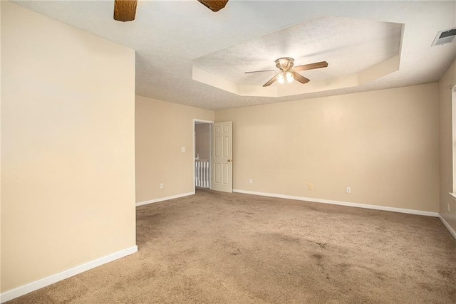 4103 Kingship Dr, Ellenwood, GA 30294 - carpeted empty room featuring ceiling fan, baseboards, a tray ceiling, and a textured ceiling