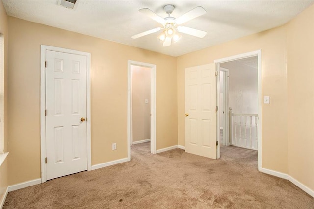 4103 Kingship Dr, Ellenwood, GA 30294 - unfurnished bedroom with carpet floors, baseboards, and a ceiling fan