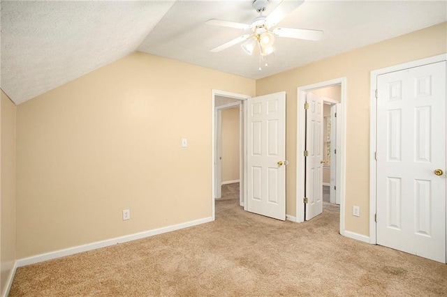 4103 Kingship Dr, Ellenwood, GA 30294 - unfurnished bedroom with light carpet, baseboards, vaulted ceiling, a ceiling fan, and ensuite bath