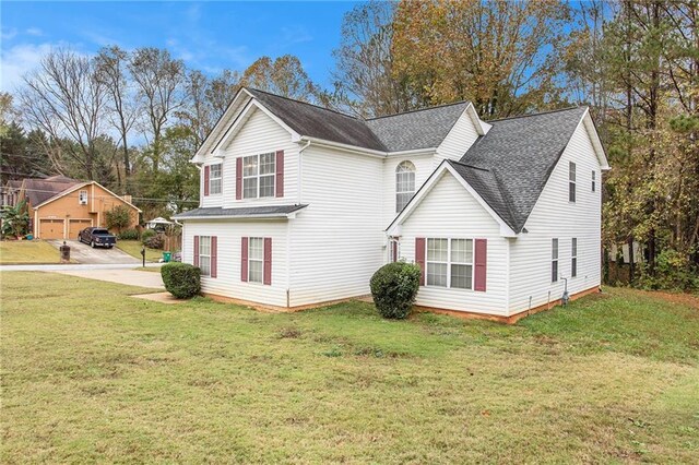 4103 Kingship Dr, Ellenwood, GA 30294 - view of side of property featuring a shingled roof and a lawn