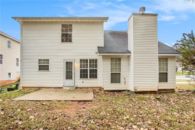 4103 Kingship Dr, Ellenwood, GA 30294 - back of house featuring a patio area, a chimney, and a shingled roof