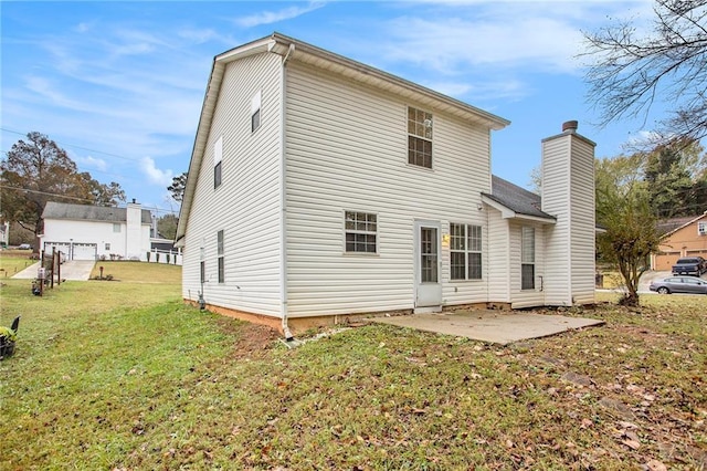 4103 Kingship Dr, Ellenwood, GA 30294 - rear view of house featuring a patio area, a yard, and a chimney