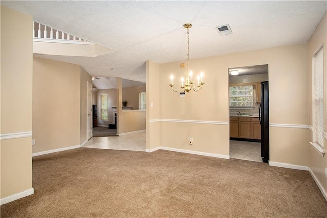 4103 Kingship Dr, Ellenwood, GA 30294 - empty room with light colored carpet, a chandelier, and baseboards