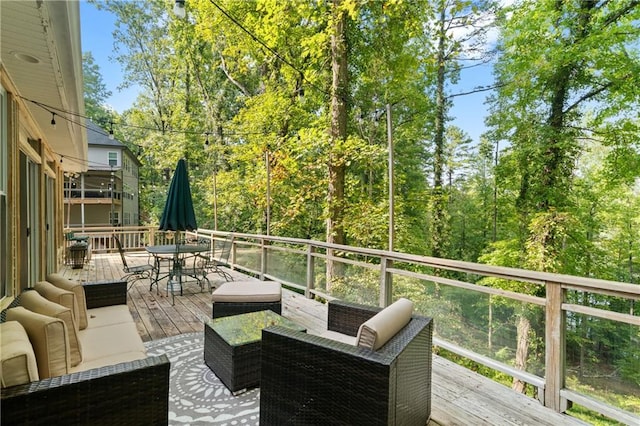 wooden terrace with outdoor lounge area