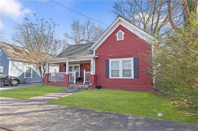 view of front of home with a porch and a front lawn