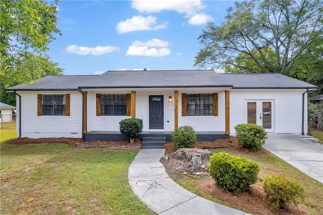 ranch-style home with a front lawn and covered porch