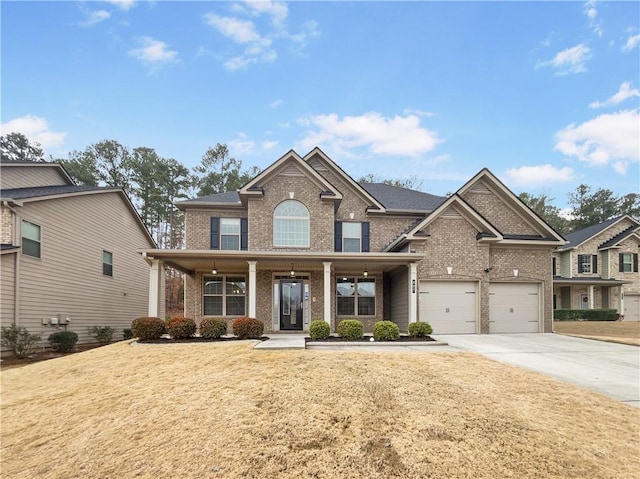 craftsman-style house with covered porch and a garage