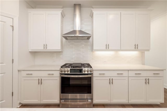 350 Olmstead Way Unit 29, Alpharetta, GA 30022 - kitchen featuring wall chimney range hood, gas range, white cabinets, light countertops, and ornamental molding