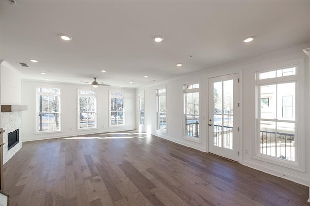350 Olmstead Way Unit 29, Alpharetta, GA 30022 - unfurnished living room with ornamental molding, plenty of natural light, a ceiling fan, a fireplace, and wood finished floors