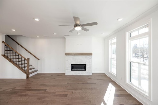 350 Olmstead Way Unit 29, Alpharetta, GA 30022 - unfurnished living room featuring wood finished floors, a stone fireplace, a ceiling fan, stairs, and recessed lighting