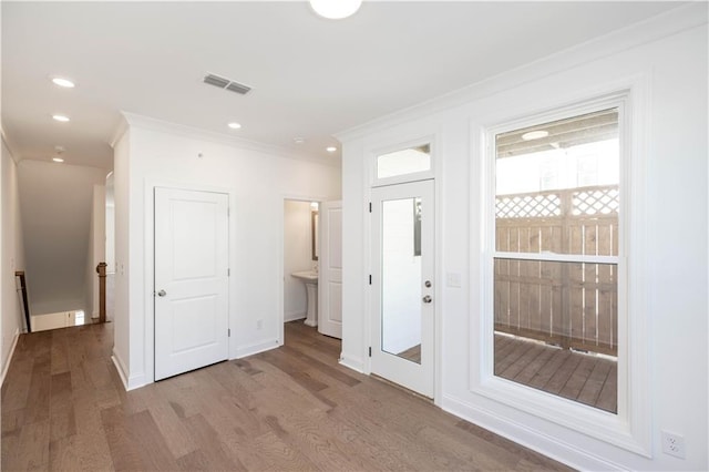 350 Olmstead Way Unit 29, Alpharetta, GA 30022 - unfurnished bedroom with wood finished floors, crown molding, ensuite bath, recessed lighting, and baseboards