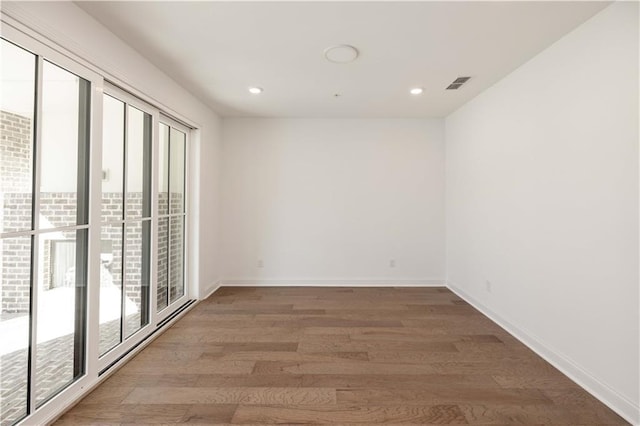 350 Olmstead Way Unit 29, Alpharetta, GA 30022 - unfurnished room with wood finished floors, recessed lighting, and baseboards