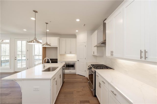 350 Olmstead Way Unit 29, Alpharetta, GA 30022 - kitchen featuring stainless steel appliances, a sink, wall chimney exhaust hood, decorative backsplash, and white cabinetry