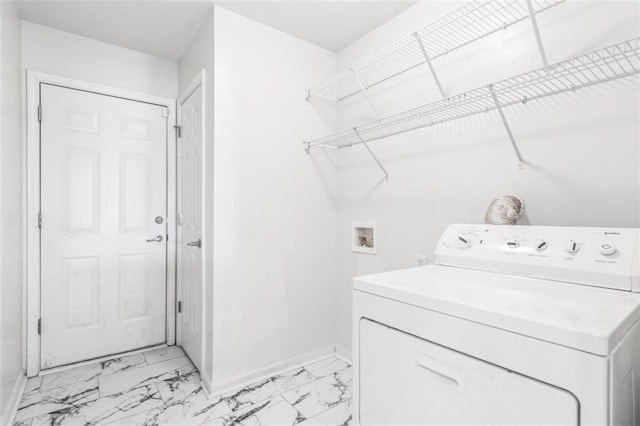 clothes washing area with laundry area, baseboards, washer / clothes dryer, and marble finish floor