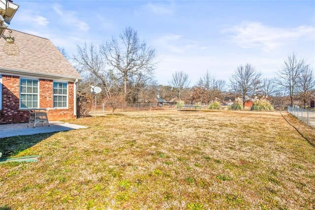 view of yard featuring a patio area and fence