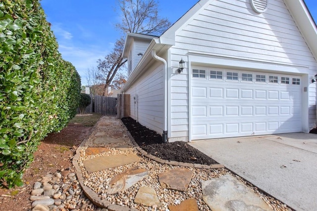 view of property exterior with a garage