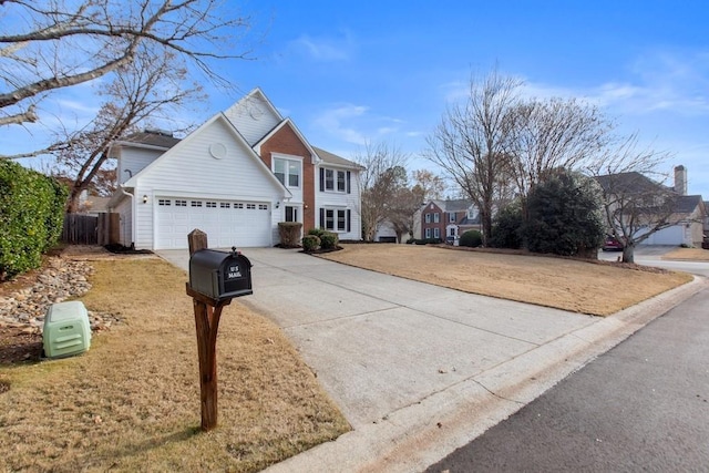 front of property featuring a garage and a front lawn