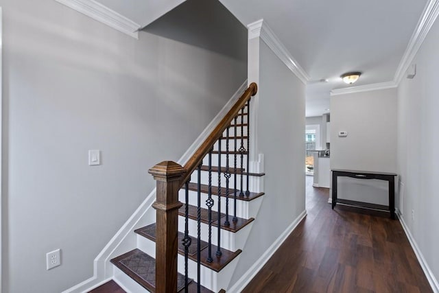 stairs with hardwood / wood-style flooring and crown molding