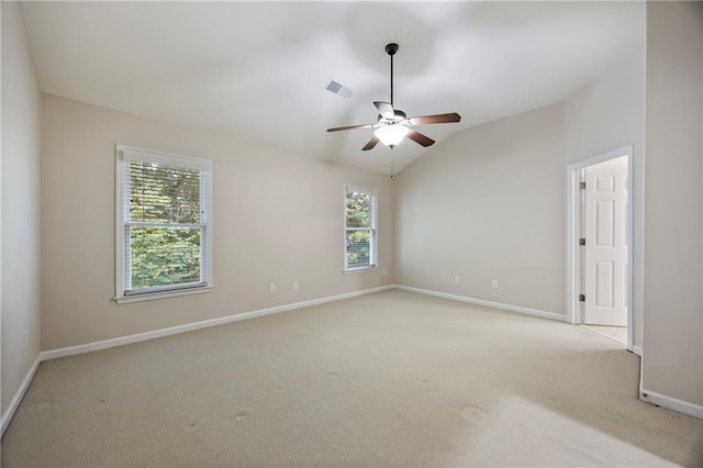 4742 Legacy Cove Ln, Smyrna, GA 30126 - unfurnished room featuring healthy amount of natural light, light carpet, a ceiling fan, and vaulted ceiling