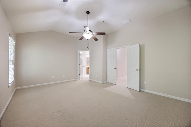 4742 Legacy Cove Ln, Smyrna, GA 30126 - unfurnished bedroom featuring light carpet, lofted ceiling, ceiling fan, and connected bathroom