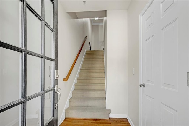 4742 Legacy Cove Ln, Smyrna, GA 30126 - staircase with baseboards and wood finished floors