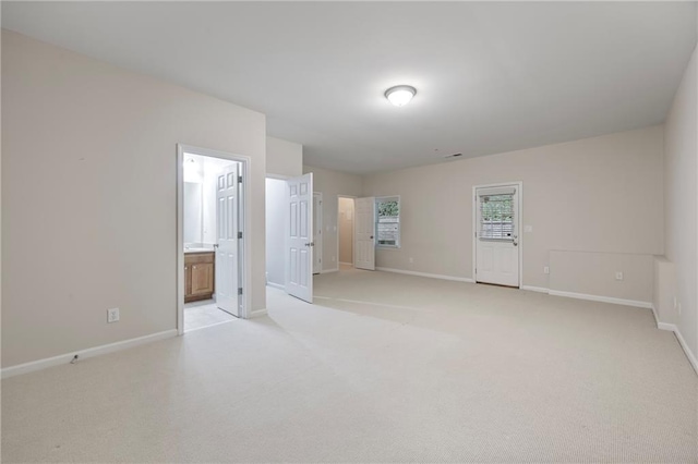 4742 Legacy Cove Ln, Smyrna, GA 30126 - spare room with baseboards and light carpet