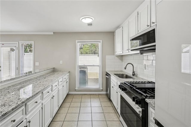 4322 Idlewood Ln, Tucker, GA 30084 - kitchen featuring tasteful backsplash, stainless steel dishwasher, range with gas cooktop, a sink, and visible vents